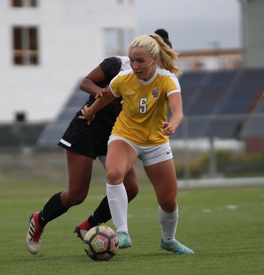 Girls celebrating a goal during Iowa cup tournament